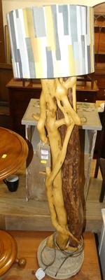 Lot 1354 - A fashioned stained root wood floor lamp