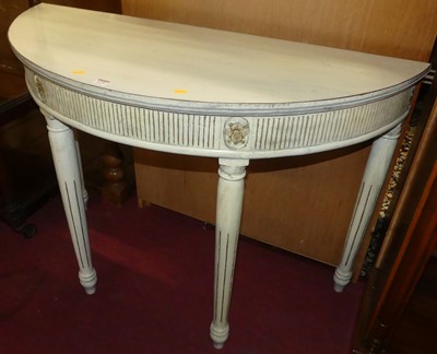 Lot 1274 - A classical style white painted demi-lune side...