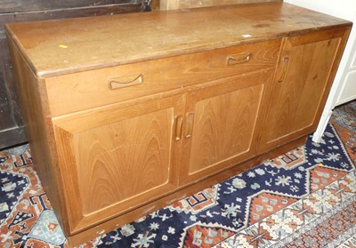 Lot 1356 - A 1970s G-Plan teak low side cupboard, fitted...