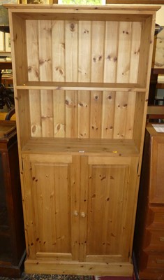 Lot 1278 - A contemporary pine double door side cupboard,...