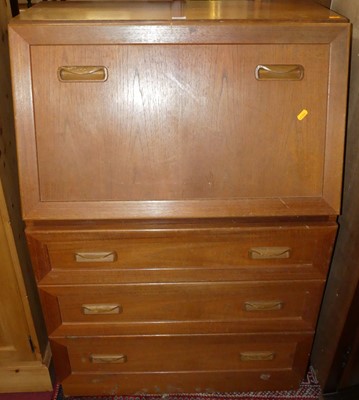 Lot 1279 - A 1980s teak slope front writing bureau, width...