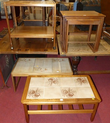 Lot 1287 - Two 1970s teak and tile topped inset coffee...