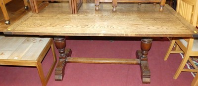 Lot 1288 - An early 20th century joined oak plank top...