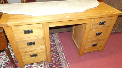 Lot 1381 - A contemporary joined blond oak kneehole...