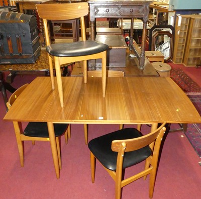 Lot 1295 - A 1970s teak veneered and beech dining suite...