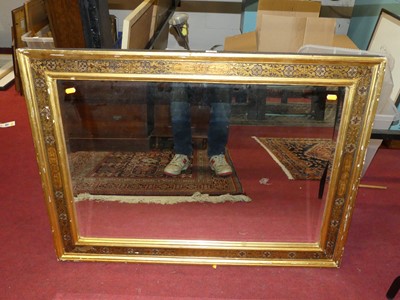 Lot 1074 - A gilt framed and bevelled rectangular wall...