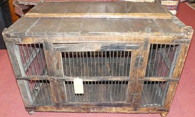 Lot 1187 - A rustic stained hardwood dog kennel, having...