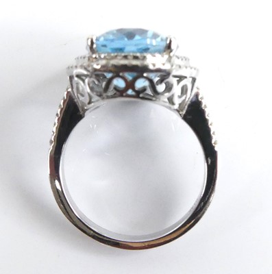 Lot 2511 - A white metal blue topaz and diamond oval...