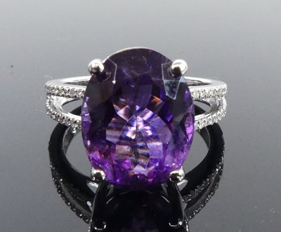 Lot 2512 - A white metal amethyst and diamond ring,...