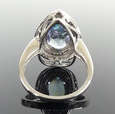 Lot 2513 - A white metal tanzanite and diamond pear...