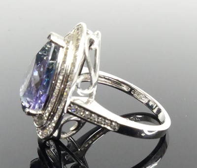 Lot 2513 - A white metal tanzanite and diamond pear...