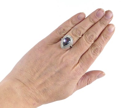 Lot 2513 - A white metal tanzanite and diamond pear...