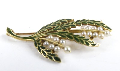 Lot 2543 - A yellow metal pearl brooch designed as a...