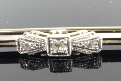 Lot 2519 - A white metal diamond bar brooch, comprising...