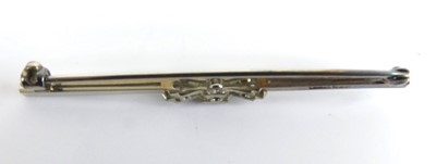 Lot 2519 - A white metal diamond bar brooch, comprising...