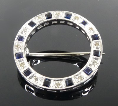 Lot 2505 - A white metal sapphire and diamond circular...