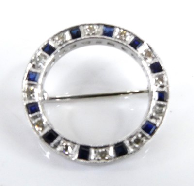 Lot 2505 - A white metal sapphire and diamond circular...
