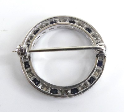 Lot 2505 - A white metal sapphire and diamond circular...