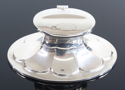 Lot 3349 - An Edwardian silver capstan inkwell of oval...