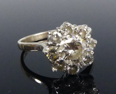 Lot 2515 - An 18ct white gold diamond circular cluster...