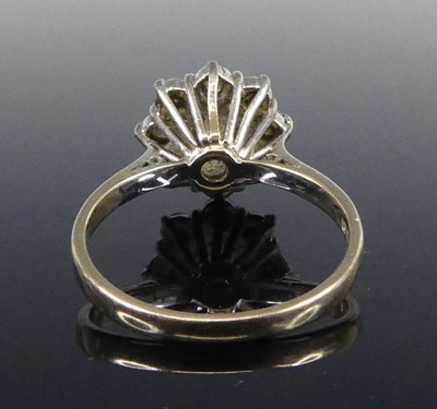 Lot 2515 - An 18ct white gold diamond circular cluster...