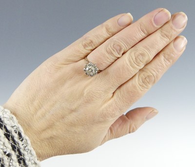 Lot 2515 - An 18ct white gold diamond circular cluster...