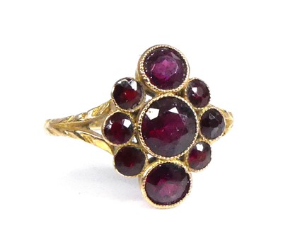 Lot 2516 - A yellow metal garnet navette cluster ring,...