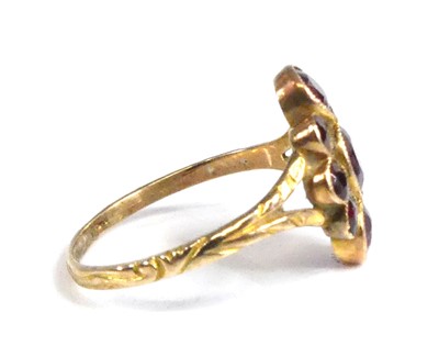 Lot 2516 - A yellow metal garnet navette cluster ring,...