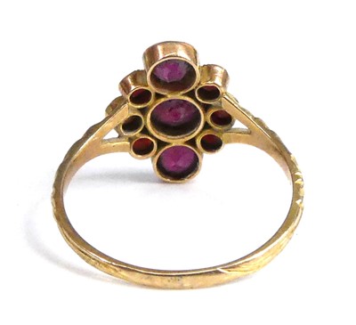 Lot 2516 - A yellow metal garnet navette cluster ring,...