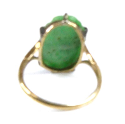 Lot 2522 - A yellow metal jadeite dress ring, comprising...