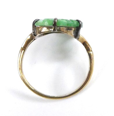 Lot 2522 - A yellow metal jadeite dress ring, comprising...