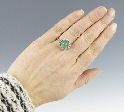 Lot 2524 - A yellow and white metal emerald and diamond...