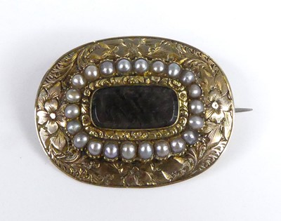 Lot 2530 - A Victorian yellow metal oval mourning brooch,...