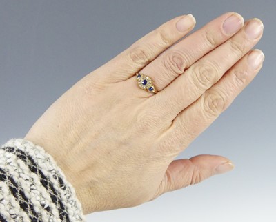 Lot 2590 - An Edwardian 18ct yellow gold sapphire and...
