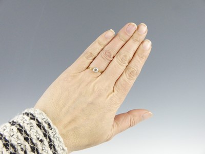 Lot 2592 - A yellow and white metal diamond solitaire...