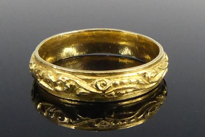 Lot 2594 - A yellow metal 4.7mm D-shaped wedding band...