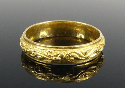 Lot 2594 - A yellow metal 4.7mm D-shaped wedding band...