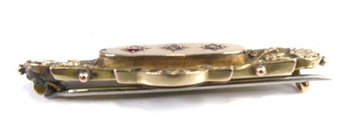 Lot 2533 - An Edwardian 9ct gold ruby and diamond set bar...