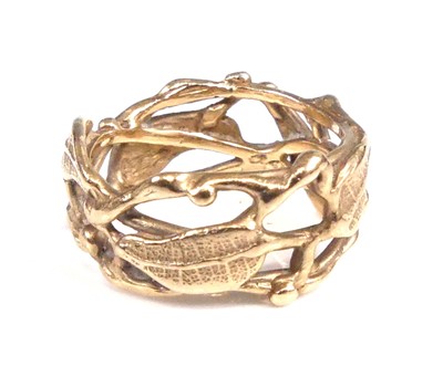 Lot 2538 - A yellow metal carved fern leaf band ring,...