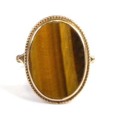 Lot 2547 - A 9ct gold tiger's eye set dress ring, the...