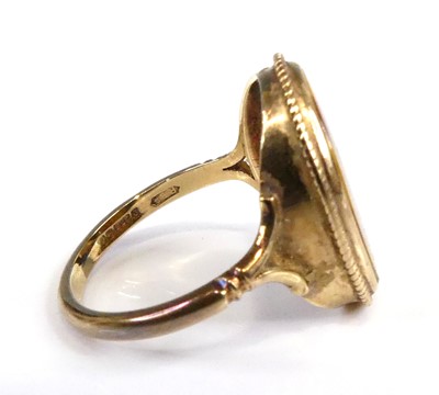 Lot 2547 - A 9ct gold tiger's eye set dress ring, the...