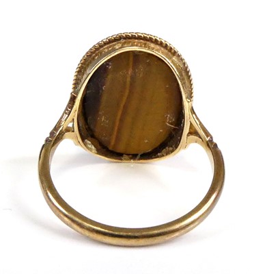 Lot 2547 - A 9ct gold tiger's eye set dress ring, the...