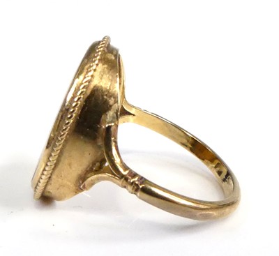 Lot 2547 - A 9ct gold tiger's eye set dress ring, the...