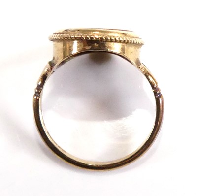 Lot 2547 - A 9ct gold tiger's eye set dress ring, the...