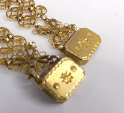 Lot 2548 - A pair of yellow metal bracelets, each...