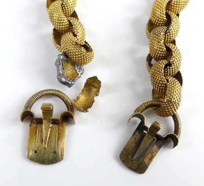 Lot 2554 - A pair of textured yellow metal belcher link...