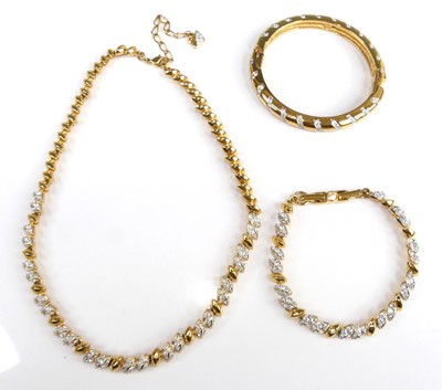 Lot 2555 - A Swarovski gilt metal crystal set hinge...