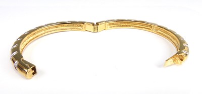 Lot 2555 - A Swarovski gilt metal crystal set hinge...