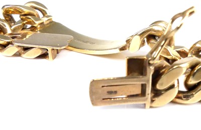 Lot 2558 - A modern 9ct gold gent's curblink identity...