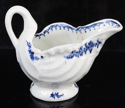 Lot 1059 - A Lowestoft porcelain dolphin ewer cream jug,...